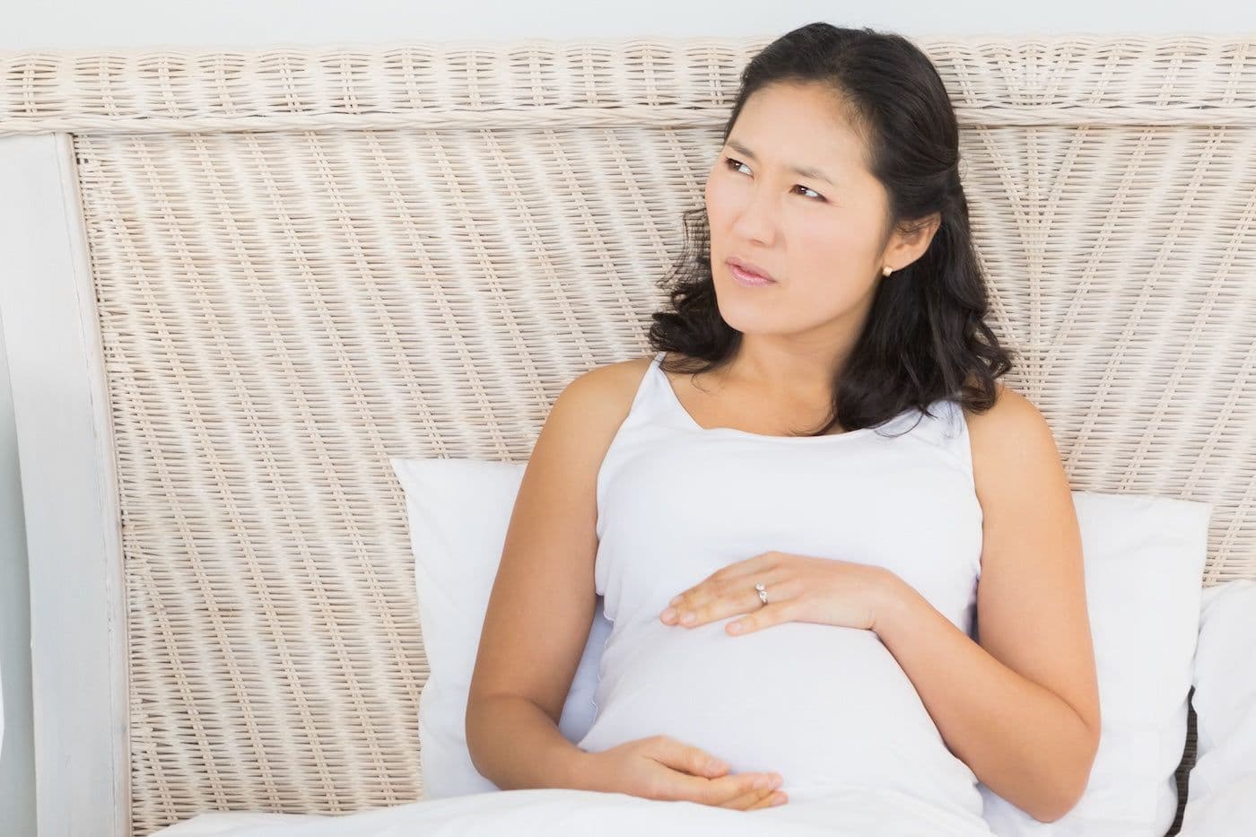 Confused looking pregnant mum