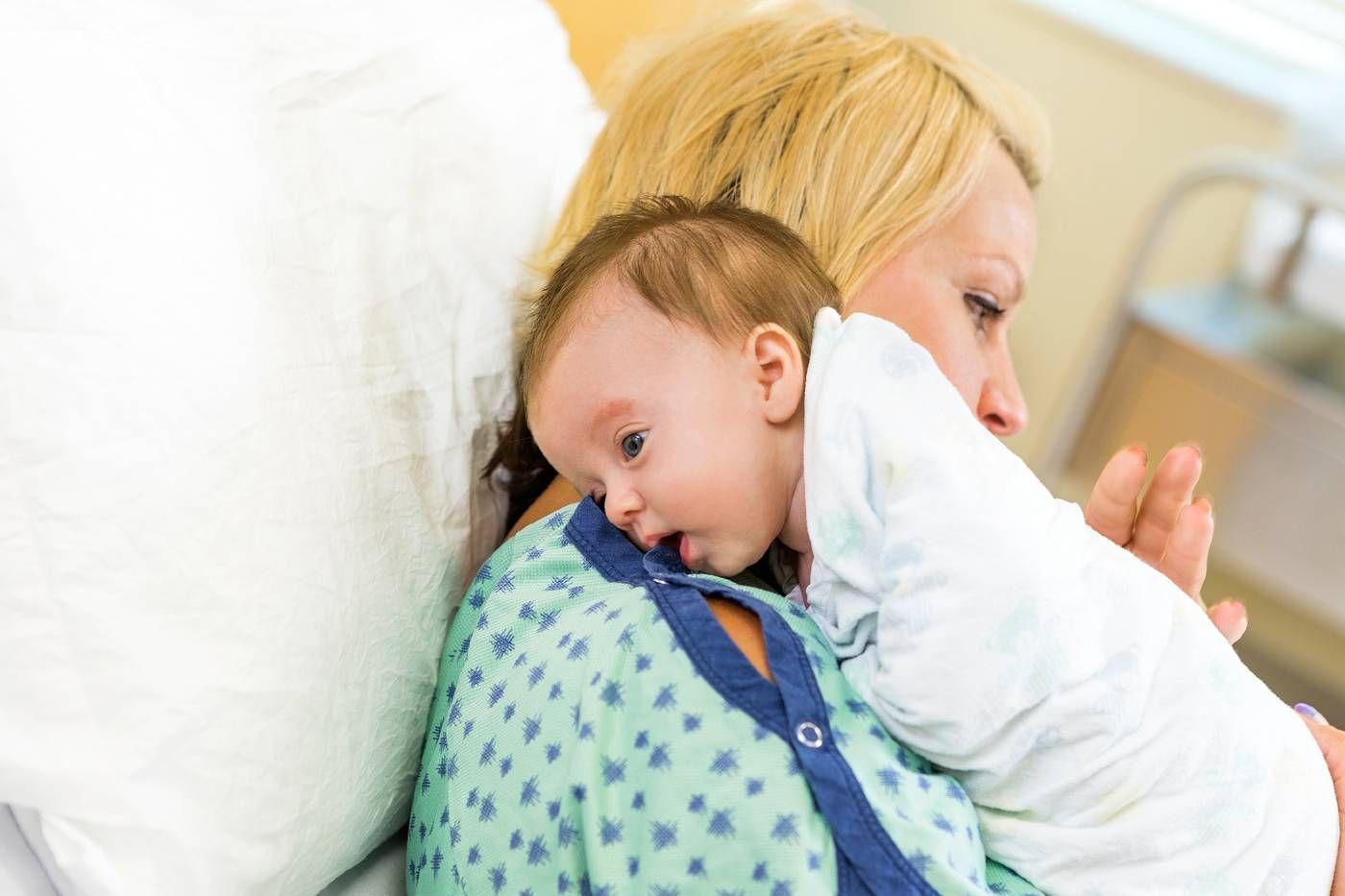 Mum burps newborn baby