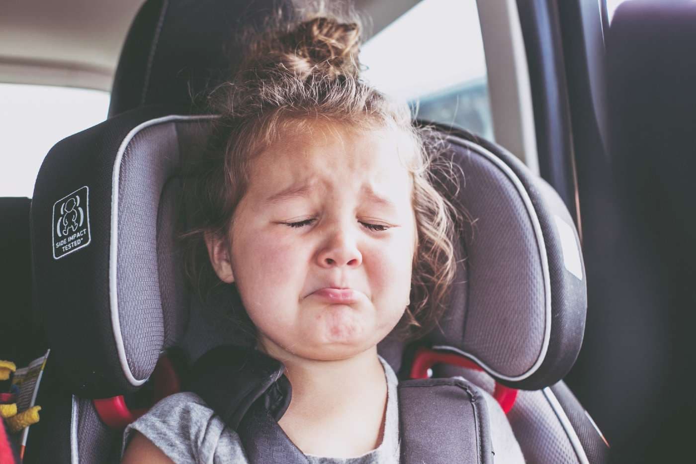 Toddler breath holding: toddler girl having a tantrum in a carseat