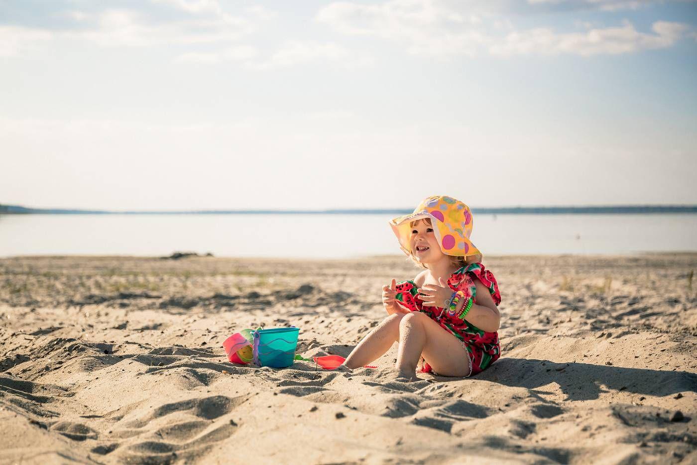 beach and ocean safety: toddler on the sand