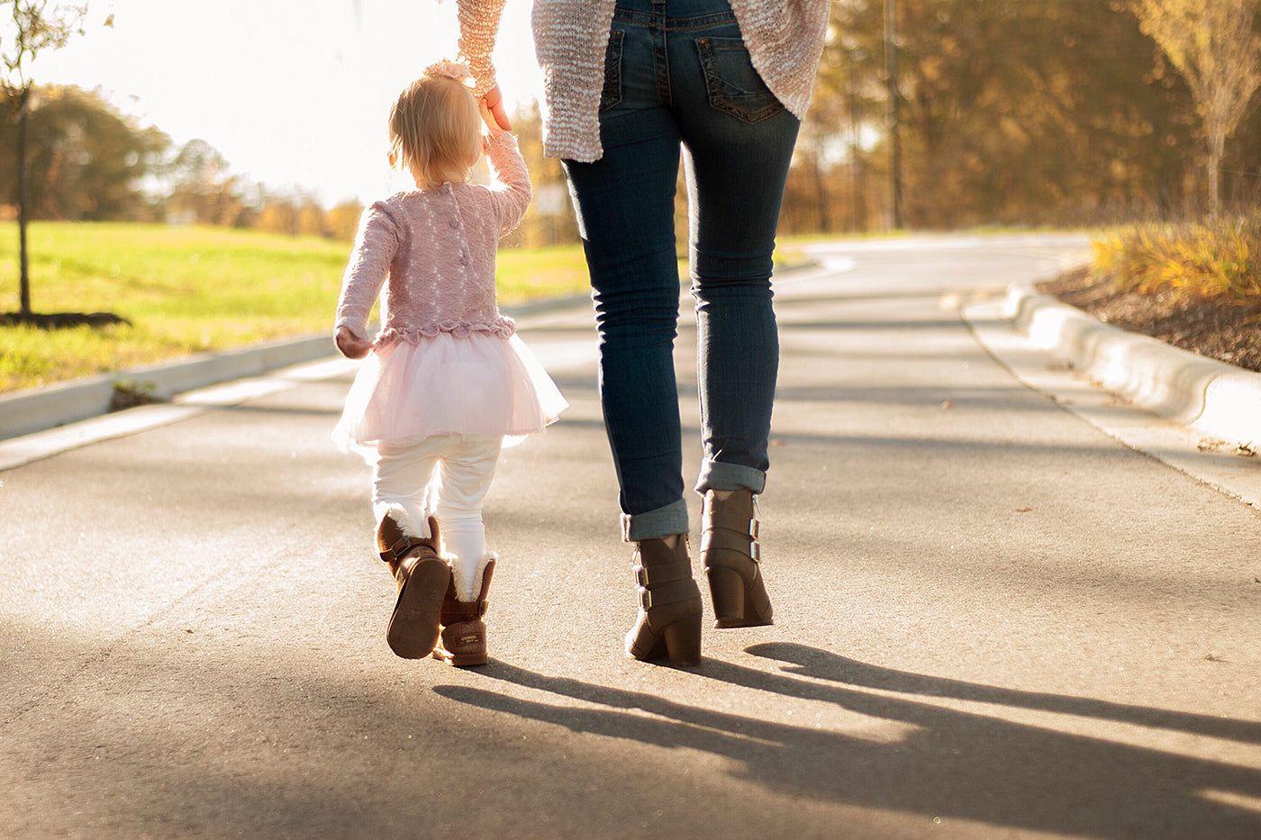 mom and toddler walking