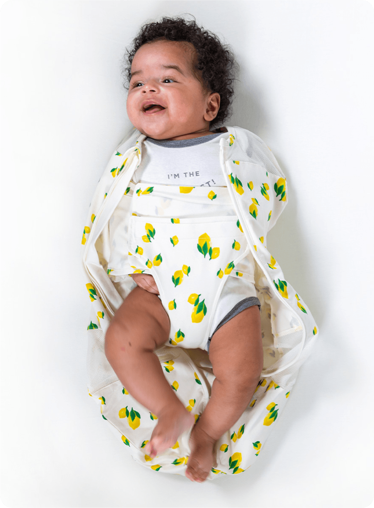 Bands pulled across Baby's arms and chest, snugly securing. Leg flap brought up between Baby's legs, and attached to the arm band