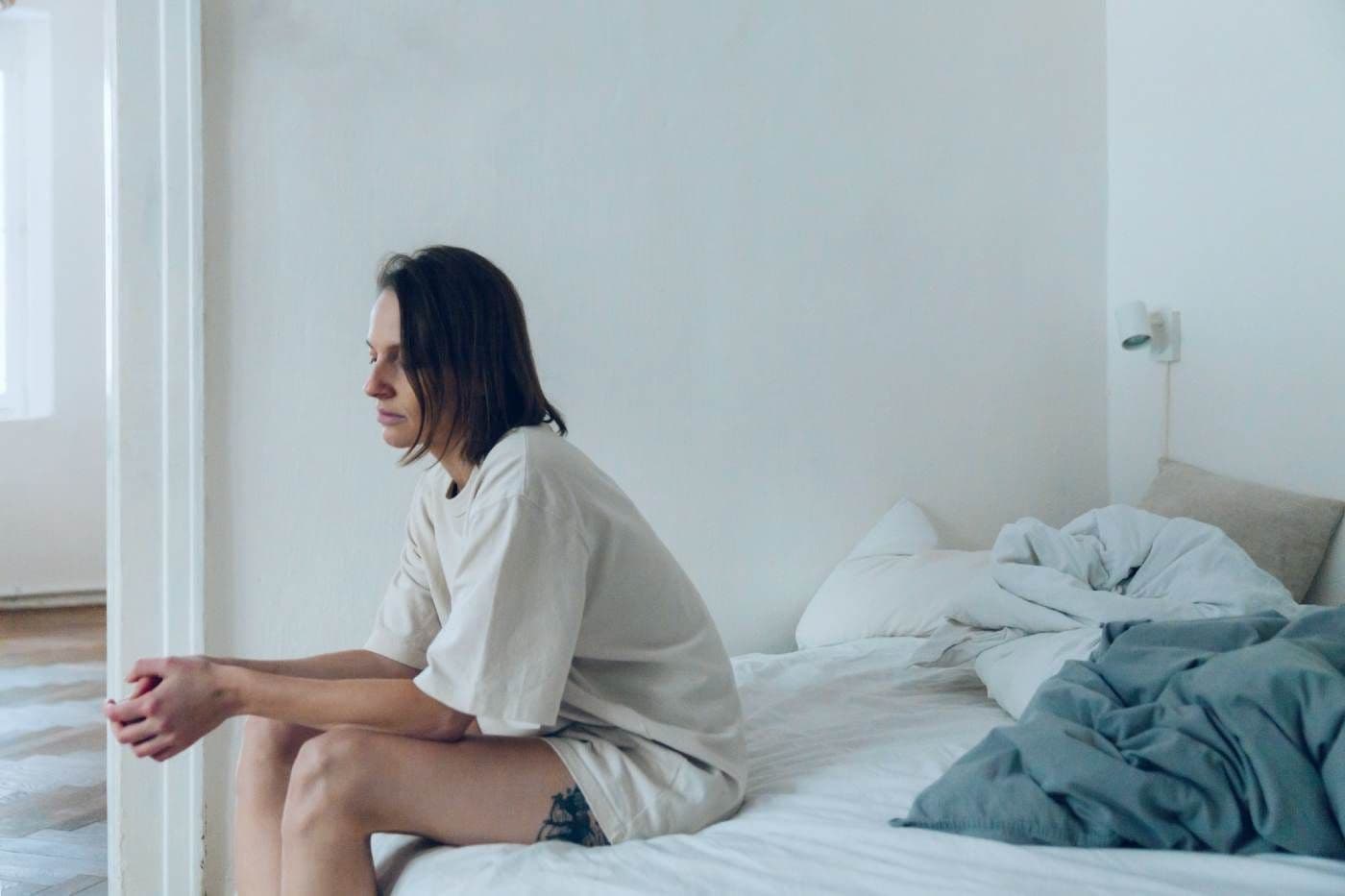 woman sitting on the bed